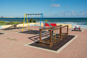 Colorful playground without children at the coast of Mediterranean sea, Torrevieja, Spain, Europe