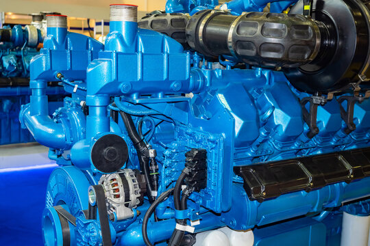 Diesel engine close up. Fragment of a diesel engine. Fragment of an electric generator. Marine diesel engine close-up. Industrial electric generator. Production generators.