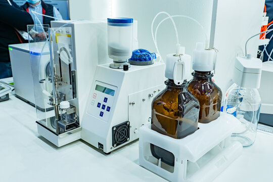 Equipment For Titration In Food Laboratory. Food Laboratory Equipment. Automatic Titrator During Operation. Food Analysis. Titration Experiments. Checking Protein In Foods. Sale Laboratory Equipment