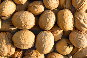 Lots of walnuts as background, texture, pattern.