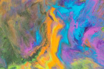 Multicolored pieces of plasticine mixed together to form an abstract background, texture, pattern.	