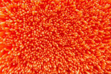 Many inflated oblong balloons in orange as background, texture, pattern.