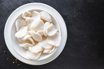 tapioca or rice chips snack meal copy space food background rustic. top view keto or paleo diet vegan or vegetarian food