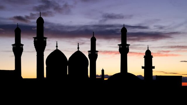 Shrine of Imam Moussa al Kadhim at Twilight, Time Lapse with Colourful Sky and Dark Silhouette of Mosque, Baghdad, Iraq