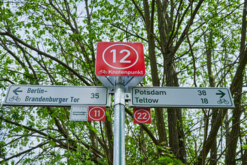 Berlin, Germany - May 15, 2021: Information sign for cyclists on the Berlin Wall Trail between Berlin and Brandenburg with various tourist destinations.