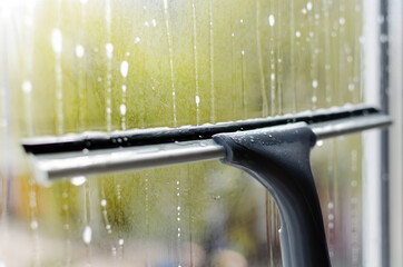 window cleaning with a window cleaning squeegee