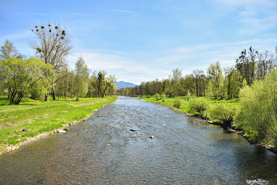 Ostravice river with mountains at background.