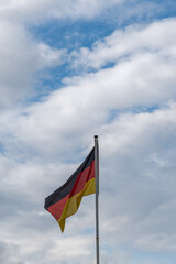 flag of germany against cloudy sky

