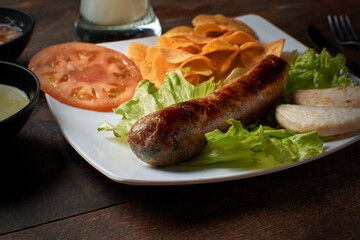 chorizo with arepa salad and juice