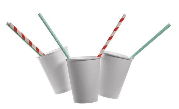 Empty white paper cup with colorful straw isolated on background, clipping path