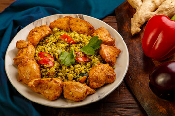 Food for suhoor in Ramadan bulgur fast with beef in a plate on a blue napkin.