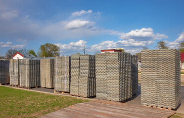 Grass concrete grating blocks stacked on pallets