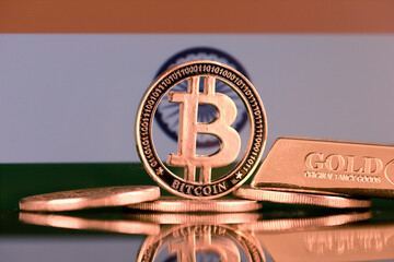 Physical version of Bitcoin, gold bar and India Flag.