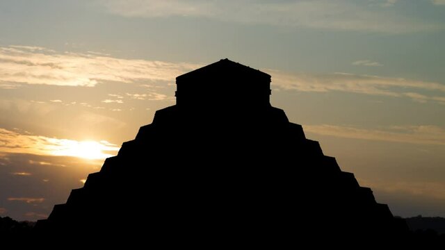 Mayan Pyramid of Kukulcan El Castillo in Chichen Itza, Time Lapse at Sunrise with Colorful Clouds, Mexico