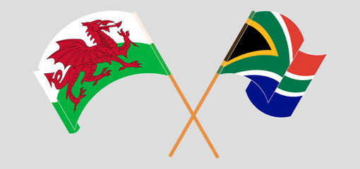 Crossed and waving flags of Wales and Republic of South Africa