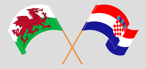 Crossed and waving flags of Wales and Croatia