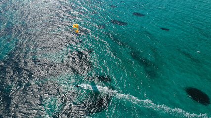 Aerial drone photo of kite surfer practise in tropical exotic island bay with emerald crystal clear sea