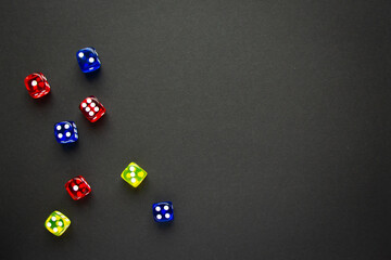 dice red and blue and yellow color black background
