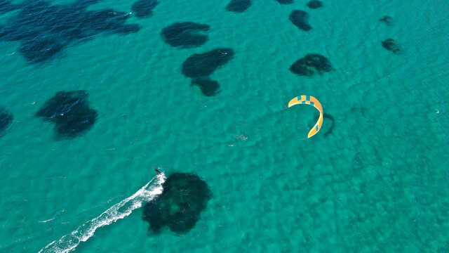 Aerial drone photo of kite surfer practise in tropical exotic island bay with emerald crystal clear sea