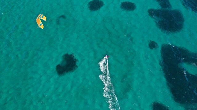 Aerial drone photo of kite surfer practise in tropical exotic island bay with emerald crystal clear sea