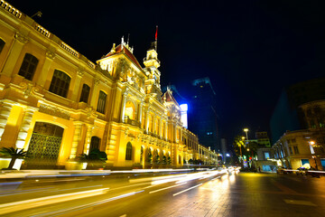 Fototapeta na wymiar Long exposure shot of the famous and beautiful People's Committee building, also named Hotel de Ville. A French colonial style building in Ho Chi Minh City (Saigon), Vietnam.