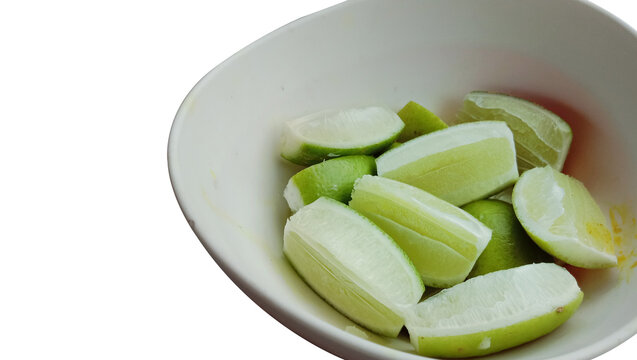 Closeup Of A Bowl With Lemon Slices Isolated On White Background