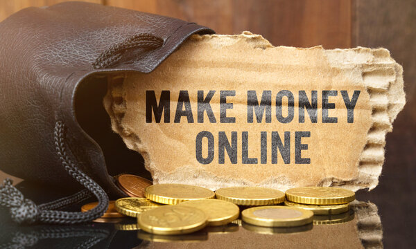On the table is a bag of money from which sticks out cardboard with the inscription - MAKE MONEY ONLINE
