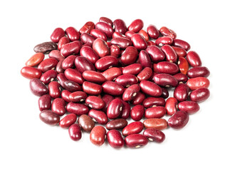 handful of mexican red beans closeup on white
