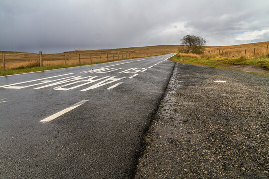 Wales road in open country. Exo triangle, the A543 road north of Pentrefoelas.
