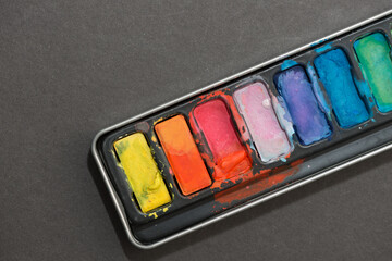 close up of a set of colorful pan paints