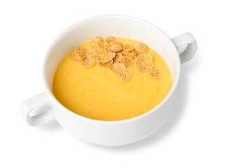 cream corn soup in a white ceramic tureen on a white background