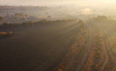 Fog railway bird's-eye landscape during sunrise