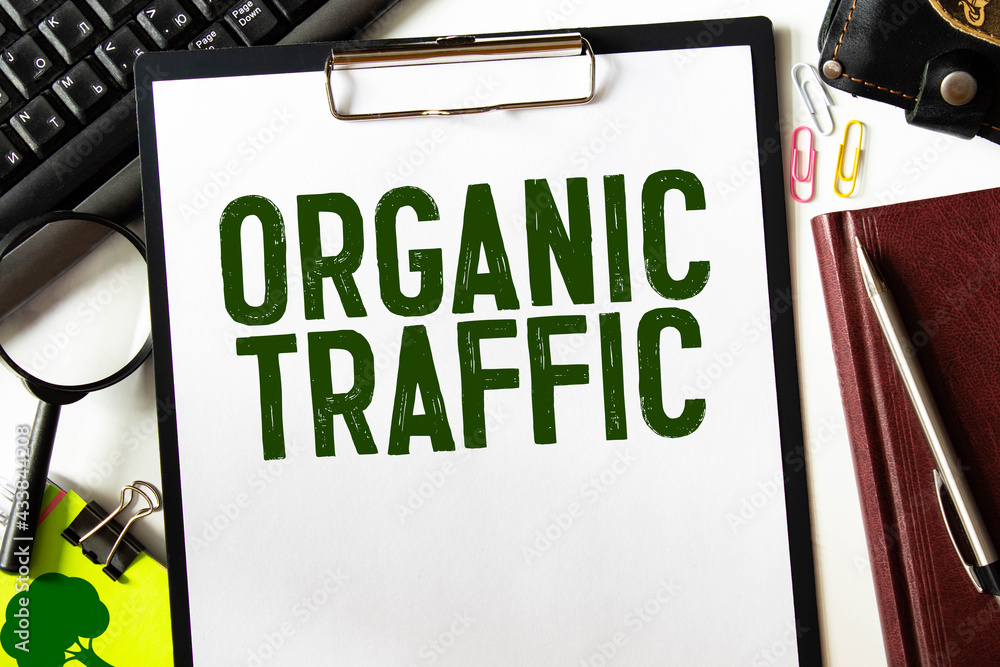 Poster organic seo traffic - text on a notebook with a spring and a gray handle