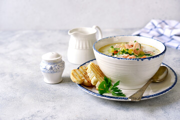 Chowder - thick potato soup with trout ( salmon ) and cream.