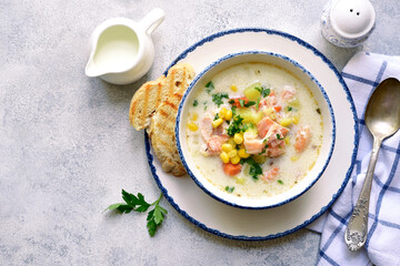 Chowder - thick potato soup with trout ( salmon ) and cream. Top view with copy space.