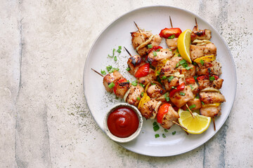Chicken kebab skewers on a plate . Top view with copy space. - 433846680