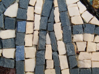 stone mosaic with white and blue tiles, closeup