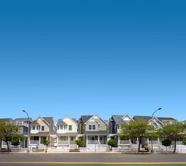 a row of suburban homes street and sidewalk spring-summer season
