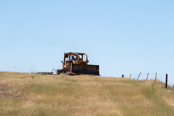 Fototapeta premium Large Bull Dozer in Open Field