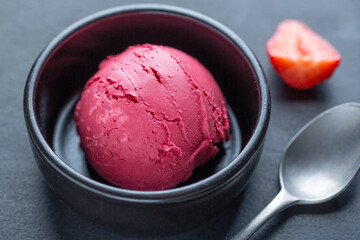 Fruity ice cream scoop on plate