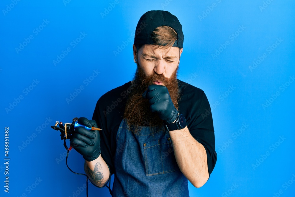 Canvas Prints Redhead man with long beard tattoo artist wearing professional uniform and gloves feeling unwell and coughing as symptom for cold or bronchitis. health care concept.