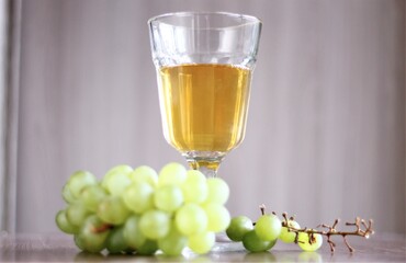 glass of white wine and green delicious grapes drinks bar 