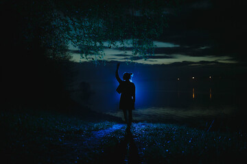 Silhouette of a girl at night.