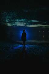 Silhouette of a girl at night.