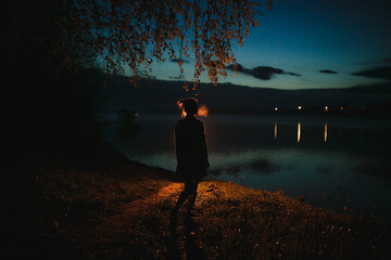 Silhouette of a girl at night.