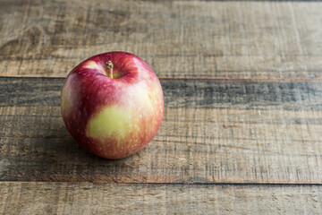 One fresh red apple on a wooden tabletop fruit diet