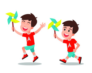 A boy playing with his paper windmill