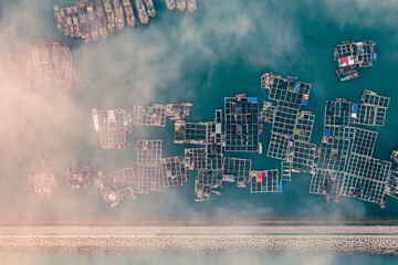 Aerial view of rows of fishing raft and fishing boats on the port