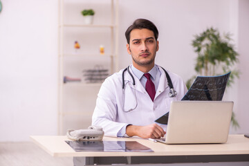 Young male doctor radiologist working in the clinic