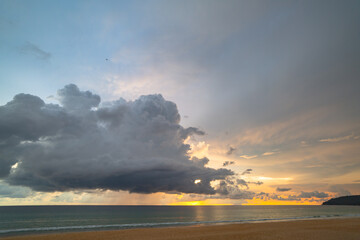 rain cloud at sunset over sea water. Evening landscape with sun over sea water..panorama rain cloud...